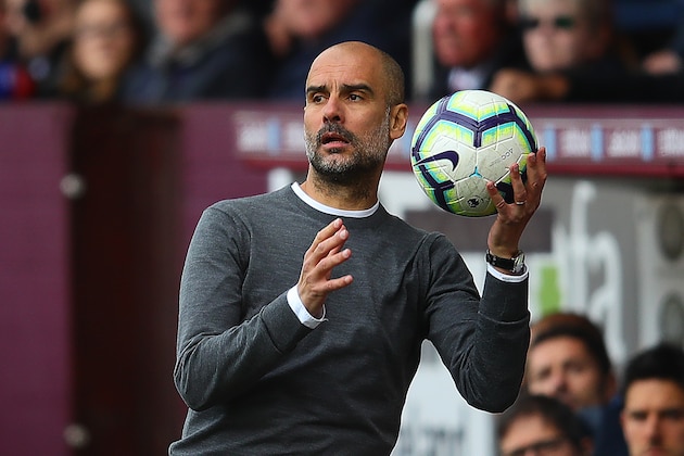 BURNLEY, ENGLAND - APRIL 28: Manchester City manager Josep Guardiola catches the ball during the Premier League match between Burnley FC and Manchester City at Turf Moor on April 28, 2019 in Burnley, United Kingdom. (Photo by Chris Brunskill/Fantasista/Getty Images)