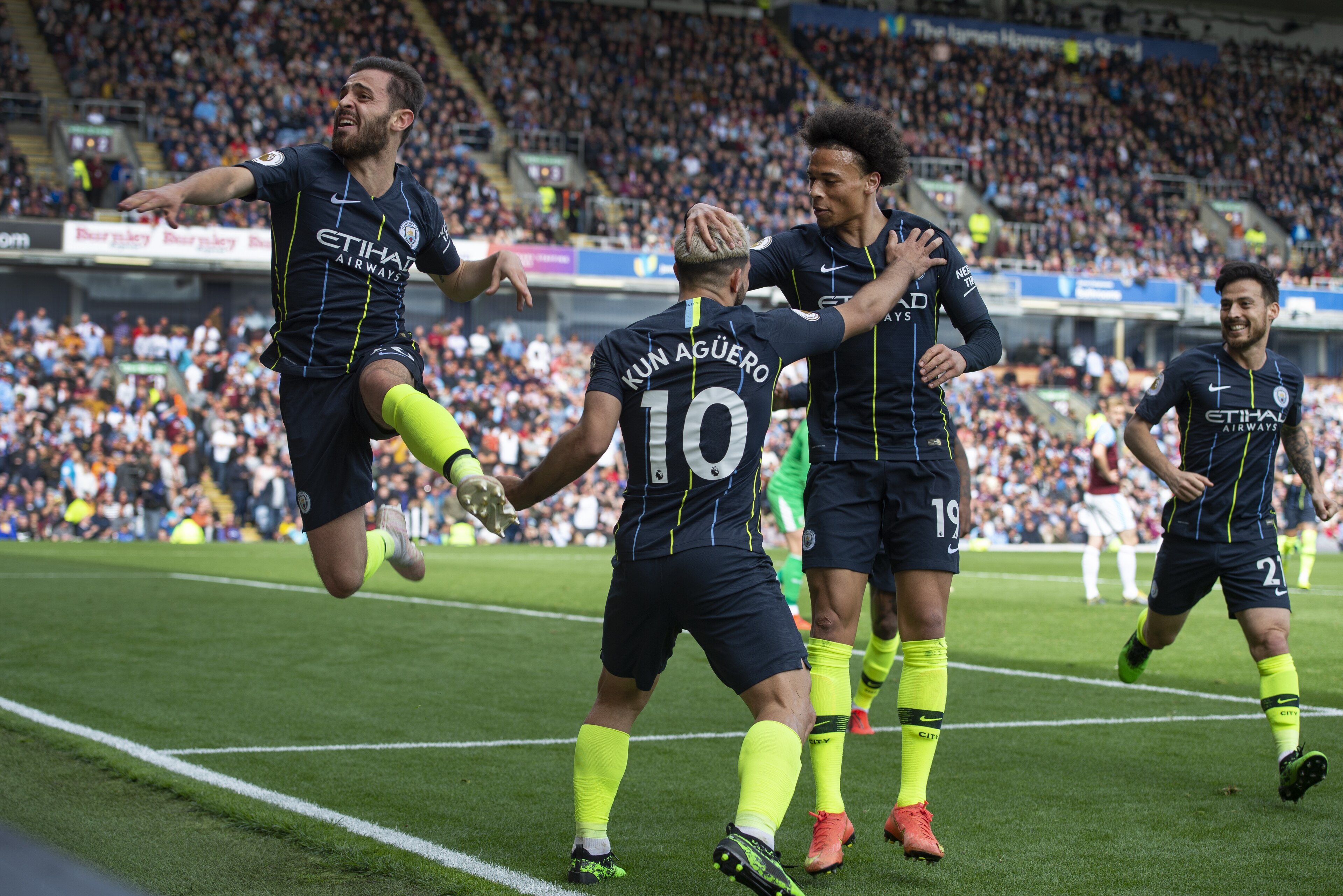 BURNLEY, ENGLAND - APRIL 28: Sergio Aguero of Manchester City celebrates his goal with team mates Bernardo Silva, Leroy Sane and David Silva during the Premier League match between Burnley FC and Manchester City at Turf Moor on April 28, 2019 in Burnley, United Kingdom. (Photo by Visionhaus/Getty Images)