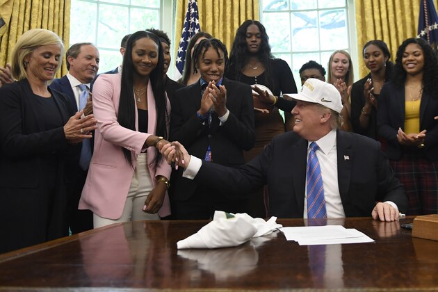 President Donald Trump shakes hands with Bayloe women's basketball player Chloe Jackson of Upper Marlboro, Md., as he welcomes members of the Baylor women's basketball team, who are the 2019 NCAA Division I Women's Basketball National Champions, to the Oval Office of the White House in Washington, Monday, April 29, 2019. (AP Photo/Susan Walsh)