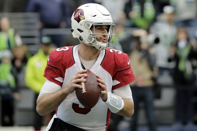 FILE - In this Dec. 30, 2018, file photo, Arizona Cardinals quarterback Josh Rosen drops back to pass against the Seattle Seahawks during the first half of an NFL football game in Seattle. Rosen, supplanted by Kyler Murray as the Cardinals’ quarterback of the future after only one season, has been traded to the Miami Dolphins in a deal that also involved two draft picks. (AP Photo/Ted S. Warren, File)