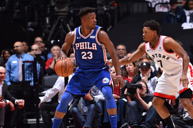 TORONTO, CANADA - APRIL 29: Jimmy Butler #23 of the Philadelphia 76ers handles the ball against Kyle Lowry #7 of the Toronto Raptors during Game Two of the Eastern Conference Semifinals of the 2019 NBA Playoffs on April 29, 2019 at the Scotiabank Arena in Toronto, Ontario, Canada.  NOTE TO USER: User expressly acknowledges and agrees that, by downloading and or using this Photograph, user is consenting to the terms and conditions of the Getty Images License Agreement.  Mandatory Copyright Notice: Copyright 2019 NBAE (Photo by Jesse D. Garrabrant/NBAE via Getty Images)