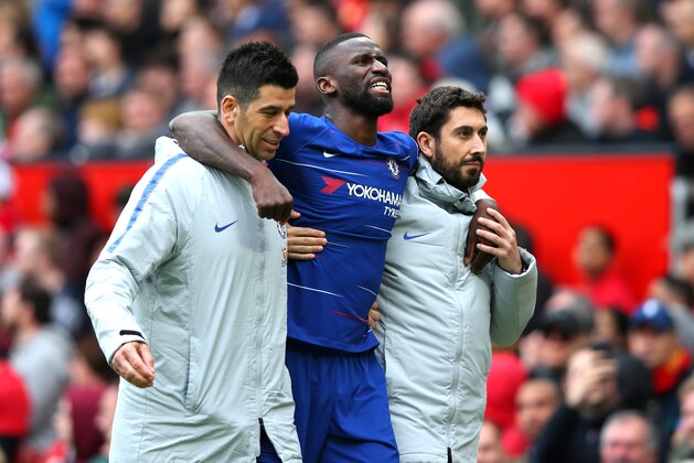 MANCHESTER, ENGLAND - APRIL 28:  An injured Antonio Ruediger of Chelsea is given assistance during the Premier League match between Manchester United and Chelsea FC at Old Trafford on April 28, 2019 in Manchester, United Kingdom. (Photo by Alex Livesey/Getty Images)
