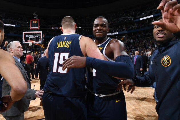 DENVER, CO - MARCH 14: Nikola Jokic #15 and Paul Millsap #4 of the Denver Nuggets celebrate after the game against the Dallas Mavericks on March 14, 2019 at the Pepsi Center in Denver, Colorado. NOTE TO USER: User expressly acknowledges and agrees that, by downloading and/or using this photograph, user is consenting to the terms and conditions of the Getty Images License Agreement. Mandatory Copyright Notice: Copyright 2019 NBAE (Photo by Garrett Ellwood/NBAE via Getty Images)