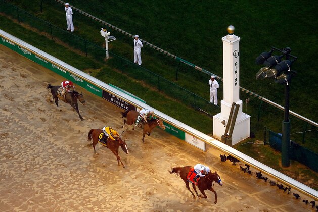 LOUISVILLE, KY - MAY 05:  Justify #7, ridden by jockey Mike Smith, crosses the finish line to win the 144th running of the Kentucky Derby at Churchill Downs on May 5, 2018 in Louisville, Kentucky.  (Photo by Jamie Squire/Getty Images)