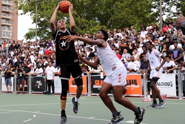 NEW YORK, NY - AUGUST 18:  RJ Hampton #5 of Team Ramsey heads for the net as Josh Christopher #3 of Team Stanley defends during the SLAM Summer Classic 2018 at Dyckman Park on August 18, 2018 in New York City.  (Photo by Elsa/Getty Images)