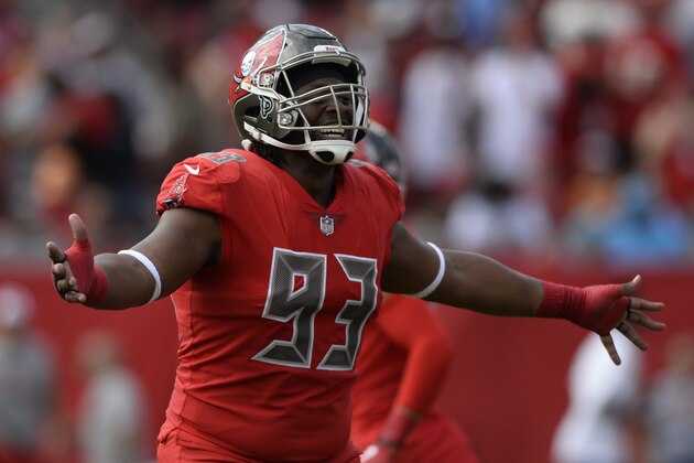 Tampa Bay Buccaneers defensive tackle Gerald McCoy (93) celebrates an interception by defensive back Andrew Adams against the Carolina Panthers during the first half of an NFL football game Sunday, Dec. 2, 2018, in Tampa, Fla. (AP Photo/Jason Behnken)