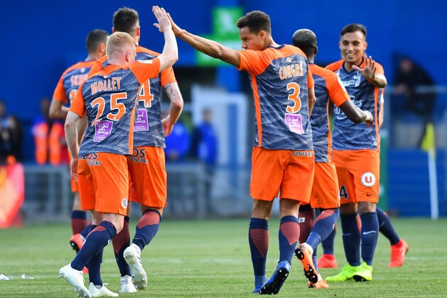 Montpellier's French midfielder Florent Mollet (L) and Montpellier's French defender Daniel Congre celebrate during the French L1 football match between Montpellier Herault SC and Paris Saint-Germain at the Mosson stadium in Montpellier, southern France on April 30, 2019. (Photo by Pascal GUYOT / AFP)        (Photo credit should read PASCAL GUYOT/AFP/Getty Images)