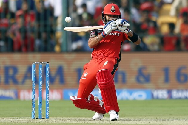 Royal Challengers Bangalore captain Virat Kohli attempts to play a shot during their Indian Premier League (IPL) cricket match against Mumbai Indians in Bangalore, India, Friday, April 14, 2017. (AP Photo/Aijaz Rahi)