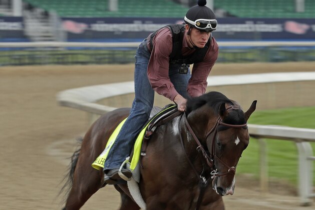 Kentucky Derby hopeful Omaha Beach is ridden during a workout at Churchill Downs Tuesday, April 30, 2019, in Louisville, Ky. The 145th running of the Kentucky Derby is scheduled for Saturday, May 4. (AP Photo/Charlie Riedel)
