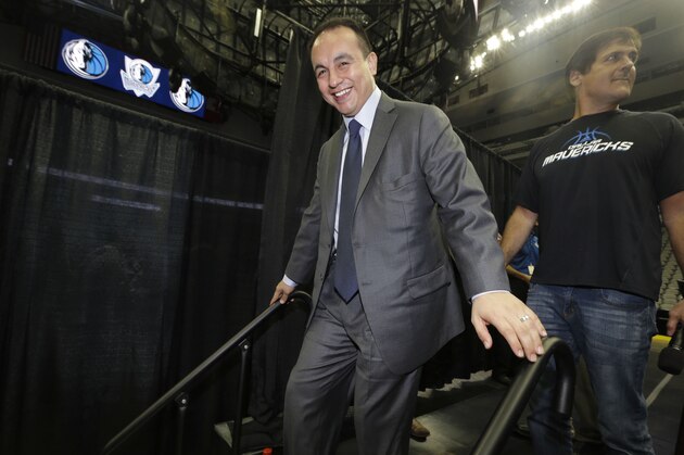 FILE - In this Aug. 15, 2013, file photo, Dallas Mavericks general manager Gersson Rosas walks off the stage after an NBA basketball news conference in Dallas. Rosas has resigned as general manager of the Mavericks just three months into his new job. He said Tuesday, Oct. 29, 2013, the position