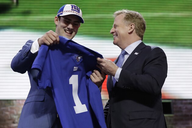 Duke quarterback Daniel Jones poses with NFL Commissioner Roger Goodell after the New York Giants selected Jones in the first round at the NFL football draft, Thursday, April 25, 2019, in Nashville, Tenn. (AP Photo/Mark Humphrey)