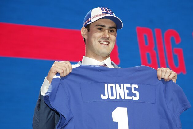 Duke quarterback Daniel Jones poses with his new team jersey after the New York Giants selected Jones in the first round at the NFL football draft, Thursday, April 25, 2019, in Nashville, Tenn. (Jeff Haynes/AP Images for Panini)