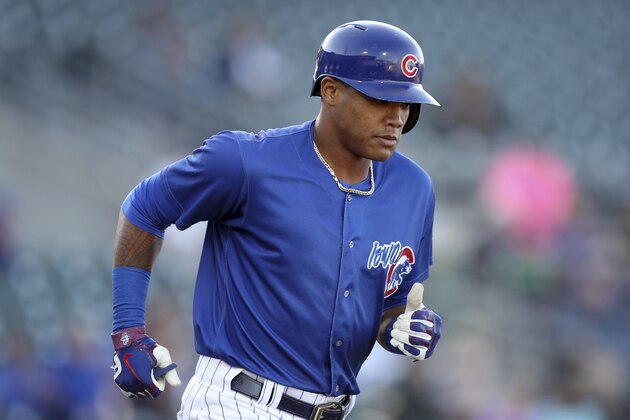 Iowa Cubs shortstop Addison Russell runs to first base during a Triple-A baseball game against the Nashville Sounds, Wednesday, April 24, 2019, in Des Moines, Iowa. Russell played in his first game of the season Wednesday for Iowa as he prepares to return to the Chicago Cubs following his domestic violence suspension. (AP Photo/Charlie Neibergall)
