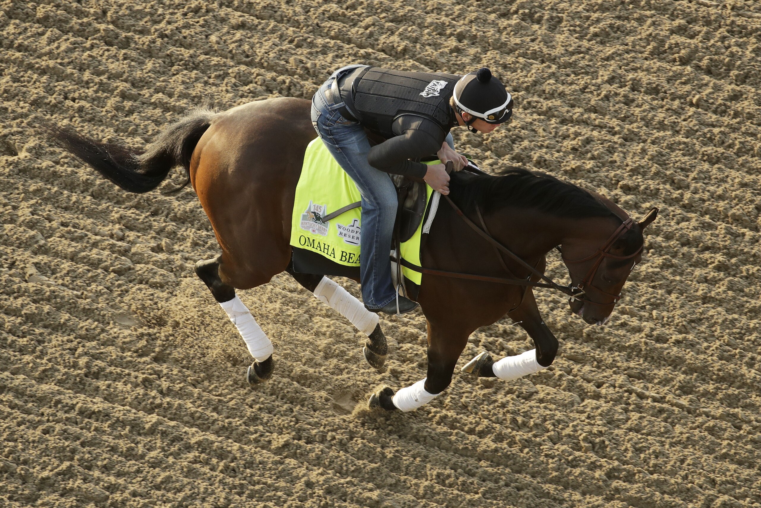 Kentucky Derby hopeful Omaha Beach is ridden during a workout at Churchill Downs Monday, April 29, 2019, in Louisville, Ky. The 145th running of the Kentucky Derby is scheduled for Saturday, May 4. (AP Photo/Charlie Riedel)