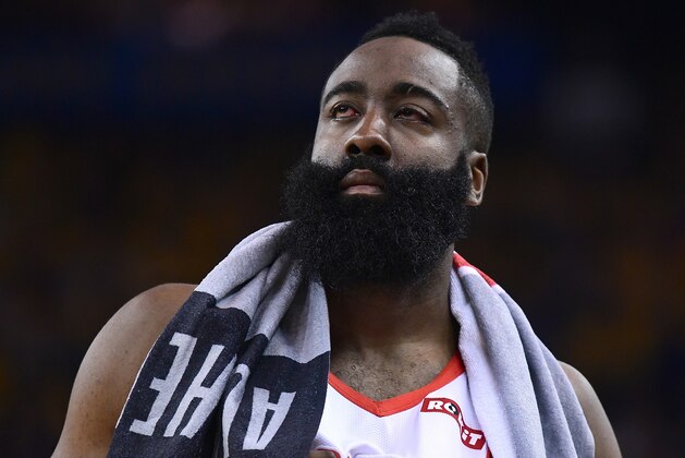 OAKLAND, CA - APRIL 30:  James Harden #13 of the Houston Rockets walks back onto the court after he was poked in the left eye by Draymond Green #23 of the Golden State Warriors in Game Two of the Second Round of the 2019 NBA Western Conference Playoffs at ORACLE Arena on April 30, 2019 in Oakland, California. NOTE TO USER: User expressly acknowledges and agrees that, by downloading and or using this photograph, User is consenting to the terms and conditions of the Getty Images License Agreement.  (Photo by Thearon W. Henderson/Getty Images)