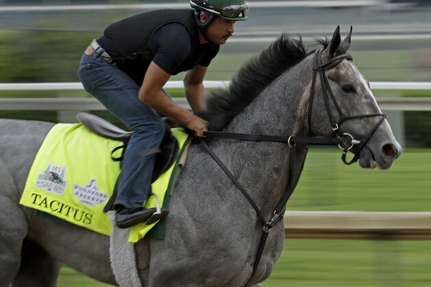 Kentucky Derby hopeful Tacitus is ridden during a workout at Churchill Downs Tuesday, April 30, 2019, in Louisville, Ky. The 145th running of the Kentucky Derby is scheduled for Saturday, May 4. (AP Photo/Charlie Riedel)