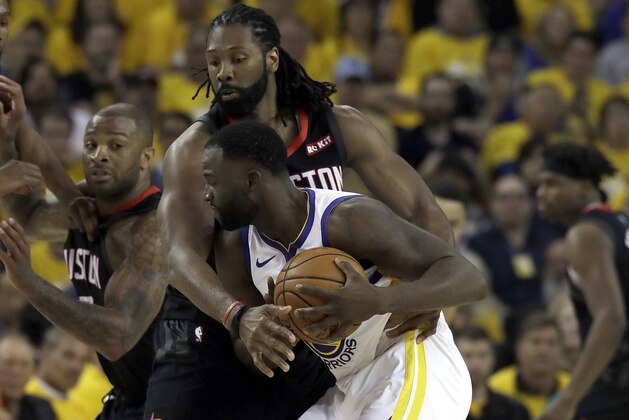 Houston Rockets center Nene Hilario, top, defends Golden State Warriors forward Draymond Green during the first half of Game 1 of a second-round NBA basketball playoff series in Oakland, Calif., Sunday, April 28, 2019. (AP Photo/Jeff Chiu)