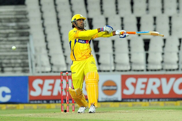 Chennai Super Kings batsman Mahendra Singh Dhoni plays a shot during the Champions League T20 (CLT20) game between the Chennai Super Kings and the Mumbai Indians at the Wanderers Stadium in Johannesburg on October 20, 2012. AFP PHOTO / ALEXANDER JOE        (Photo credit should read ALEXANDER JOE/AFP/Getty Images)