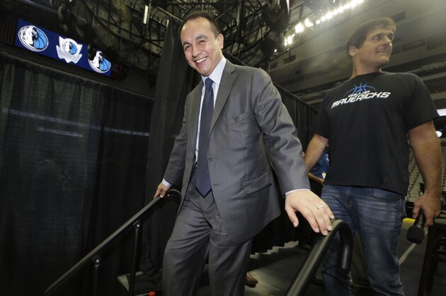 FILE - In this Aug. 15, 2013, file photo, Dallas Mavericks general manager Gersson Rosas walks off the stage after an NBA basketball news conference in Dallas. Rosas has resigned as general manager of the Mavericks just three months into his new job. He said Tuesday, Oct. 29, 2013, the position