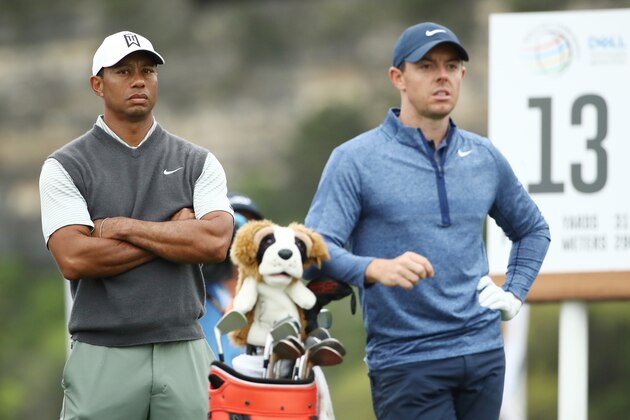 AUSTIN, TEXAS - MARCH 30: Tiger Woods of the United States and Rory McIlroy of Northern Ireland stand on the 13th tee during the fourth round of the World Golf Championships-Dell Technologies Match Play at Austin Country Club on March 30, 2019 in Austin, Texas. (Photo by Ezra Shaw/Getty Images)