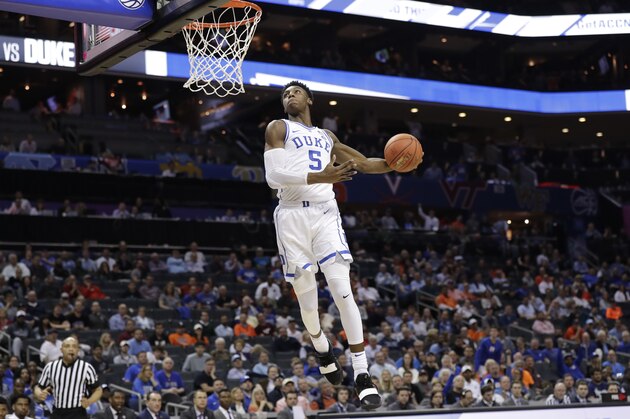 Duke's RJ Barrett (5) goes up to dunk against Syracuse during the second half of an NCAA college basketball game in the Atlantic Coast Conference tournament in Charlotte, N.C., Thursday, March 14, 2019. (AP Photo/Chuck Burton)