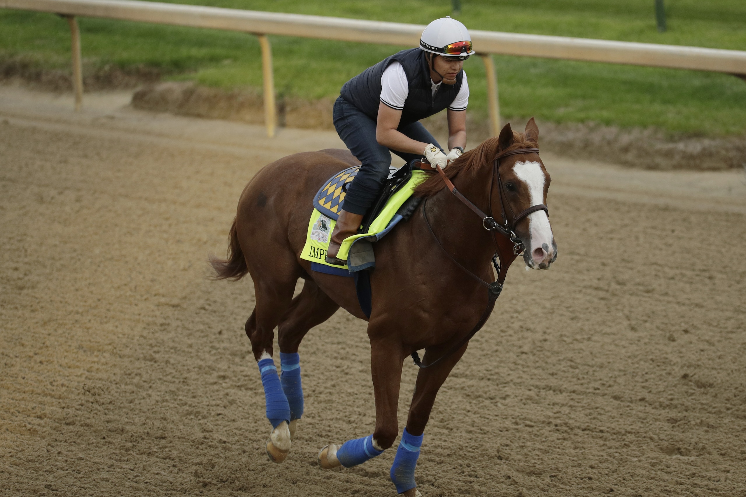 Kentucky Derby entrant Improbable is ridden during a workout at Churchill Downs Wednesday, May 1, 2019, in Louisville, Ky. The 145th running of the Kentucky Derby is scheduled for Saturday, May 4. (AP Photo/Charlie Riedel) Kentucky Derby entrant Improbable is ridden during a workout at Churchill Downs Wednesday, May 1, 2019, in Louisville, Ky. The 145th running of the Kentucky Derby is scheduled for Saturday, May 4. (AP Photo/Charlie Riedel)
