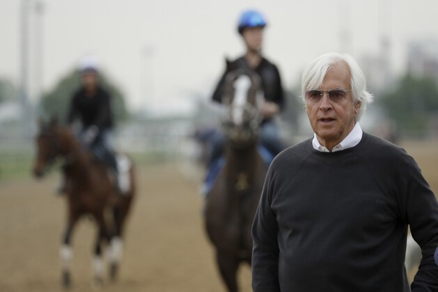 Trainer Bob Baffert, who has three Kentucky Derby hopefuls, watches on the track during a workout at Churchill Downs Tuesday, April 30, 2019, in Louisville, Ky. The 145th running of the Kentucky Derby is scheduled for Saturday, May 4. (AP Photo/Charlie Riedel)