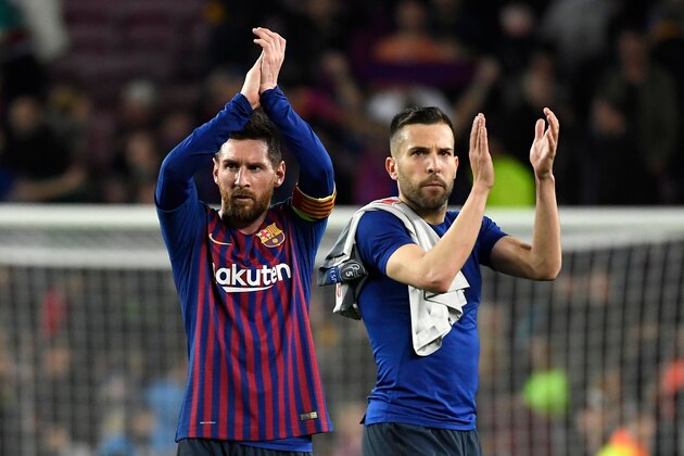 Barcelona's Argentinian forward Lionel Messi (L) and Barcelona's Spanish defender Jordi Alba celebrate at the end of the UEFA Champions League semi-final first leg football match between Barcelona and Liverpool at the Camp Nou Stadium in Barcelona on May 1, 2019. (Photo by LLUIS GENE / AFP)        (Photo credit should read LLUIS GENE/AFP/Getty Images)