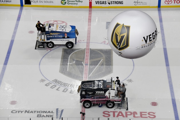 LAS VEGAS, NV - MARCH 31:  Richard Crossley (above) and Nick Salami operate ice resurfacers in the rink under the Vegas Golden Knights ZipBlimp before a game between the San Jose Sharks and the Golden Knights at T-Mobile Arena on March 31, 2018 in Las Vegas, Nevada. The Golden Knights won 3-2 and clinched the Pacific Division title.  (Photo by Ethan Miller/Getty Images)