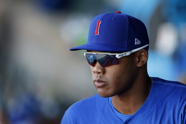 Iowa Cubs shortstop Addison Russell walks out of the dugout before a Triple-A baseball game against the Nashville Sounds, Wednesday, April 24, 2019, in Des Moines, Iowa. Russell played in his first game of the season Wednesday for Iowa as he prepares to return to the Chicago Cubs following his domestic violence suspension. (AP Photo/Charlie Neibergall)