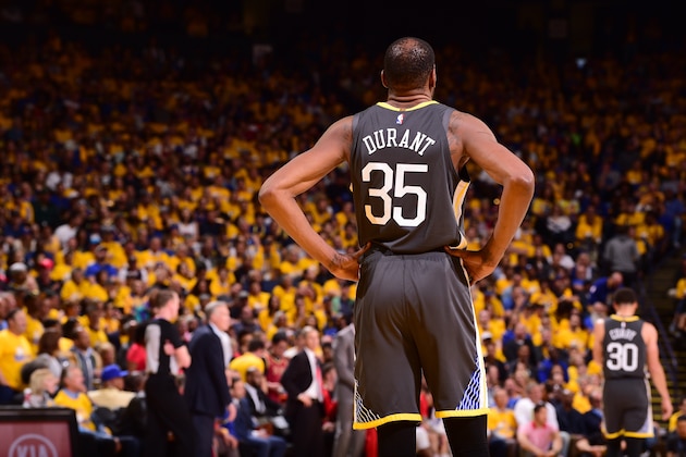 OAKLAND, CA - APRIL 30:  Kevin Durant #35 of the Golden State Warriors looks on during Game Two of the Western Conference Semifinals of the 2019 NBA Playoffs on April 30, 2019 at ORACLE Arena in Oakland, California. NOTE TO USER: User expressly acknowledges and agrees that, by downloading and or using this photograph, user is consenting to the terms and conditions of Getty Images License Agreement. Mandatory Copyright Notice: Copyright 2019 NBAE (Photo by Noah Graham/NBAE via Getty Images)