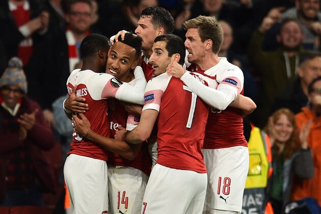 Arsenal's Gabonese striker Pierre-Emerick Aubameyang (2nd L) celebrates with teammates after scoring their third goal during the UEFA Europa League semi final, first leg, football match between Arsenal and Valencia at the Emirates Stadium in London on May 2, 2019. (Photo by Glyn KIRK / AFP)        (Photo credit should read GLYN KIRK/AFP/Getty Images)