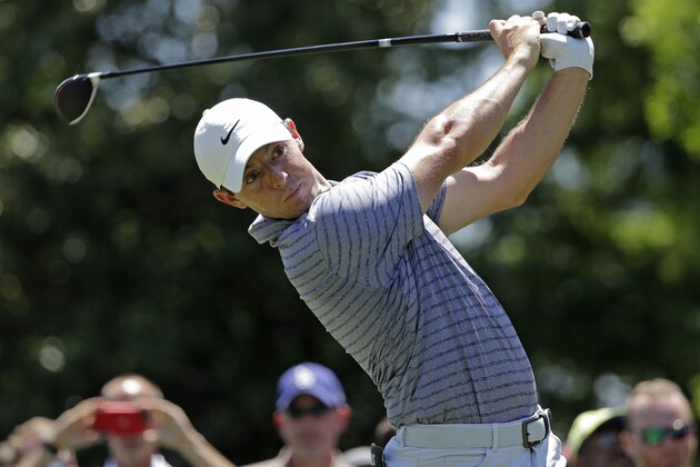 Rory McIlroy, of Northern Ireland, watches his tee shot on the third hole during the first round of the Wells Fargo Championship golf tournament at Quail Hollow Club in Charlotte, N.C., Thursday, May 2, 2019. (AP Photo/Chuck Burton)