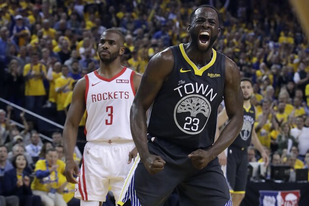 Golden State Warriors' Draymond Green (23) reacts after scoring, in front of Houston Rockets' Chris Paul (3) during the second half of Game 2 of a second-round NBA basketball playoff series in Oakland, Calif., Tuesday, April 30, 2019. (AP Photo/Jeff Chiu)
