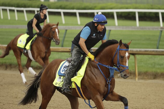 Kentucky Derby entrants By My Standards, right, and Country House run during a workout at Churchill Downs Thursday, May 2, 2019, in Louisville, Ky. The 145th running of the Kentucky Derby is scheduled for Saturday, May 4. (AP Photo/Charlie Riedel)