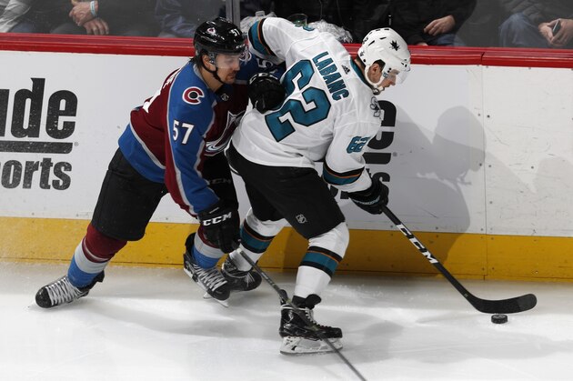 San Jose Sharks right wing Kevin Labanc, right, is checked by Colorado Avalanche left wing Gabriel Bourque during the third period of Game 4 of an NHL hockey second-round playoff series Thursday, May 2, 2019, in Denver. The Avalanche won 3-0. (AP Photo/David Zalubowski)