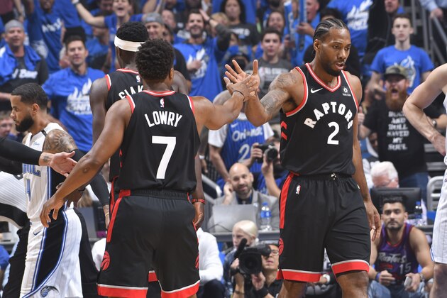 ORLANDO, FL - APRIL 19: Kawhi Leonard #2 and Kyle Lowry #7 of the Toronto Raptors celebrates during the game against the Orlando Magicduring Game Three of Round One of the 2019 NBA Playoffs on April 19, 2019 at Amway Center in Orlando, Florida. NOTE TO USER: User expressly acknowledges and agrees that, by downloading and or using this photograph, User is consenting to the terms and conditions of the Getty Images License Agreement. Mandatory Copyright Notice: Copyright 2019 NBAE (Photo by Fernando Medina/NBAE via Getty Images)