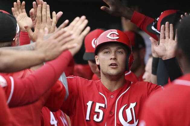 Cincinnati Reds' Nick Senzel (15) celebrates his run scored against the Cleveland Indians during the second inning of a spring training baseball game Monday, March 11, 2019, in Goodyear, Ariz. (AP Photo/Ross D. Franklin)