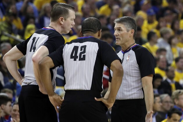 Referees huddle during the first half of Game 2 of a second-round NBA basketball playoff series between the Golden State Warriors and the Houston Rockets in Oakland, Calif., Tuesday, April 30, 2019. (AP Photo/Jeff Chiu)