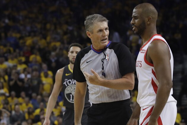 Houston Rockets' Chris Paul, right, talks to referee Scott Foster during the first half of Game 2 of a second-round NBA basketball playoff series against the Golden State Warriors in Oakland, Calif., Tuesday, April 30, 2019. (AP Photo/Jeff Chiu)