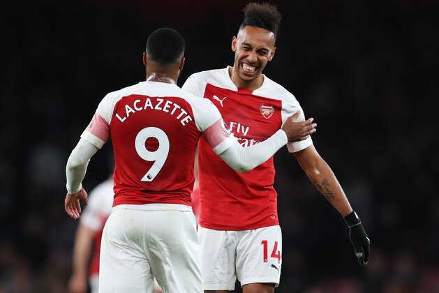 LONDON, ENGLAND - APRIL 01:  Pierre-Emerick Aubameyang (14) and Alexandre Lacazette of Arsenal celebrate victory after the the Premier League match between Arsenal FC and Newcastle United at Emirates Stadium on April 01, 2019 in London, United Kingdom. (Photo by Catherine Ivill/Getty Images)