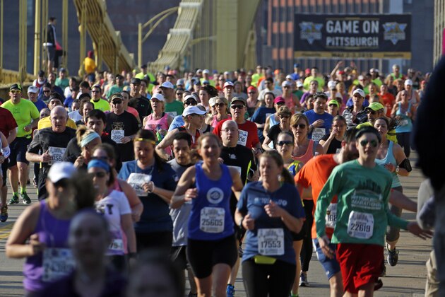 Runner's in the Pittsburgh Marathon cross the Andy Warhol Bridge in downtown Pittsburgh Sunday, May 3, 2015. (AP Photo/Gene J. Puskar)