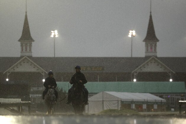 Horses come off the track after an early-morning workout at Churchill Downs Friday, May 3, 2019, in Louisville, Ky. The 145th running of the Kentucky Derby is scheduled for Saturday, May 4. (AP Photo/Charlie Riedel)