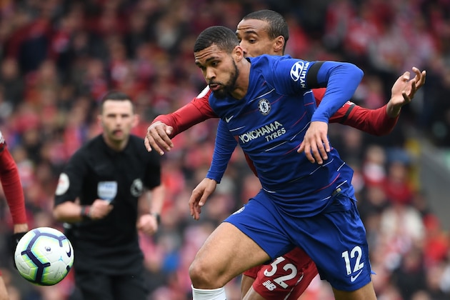 Chelsea's English midfielder Ruben Loftus-Cheek vies with Liverpool's German-born Cameroonian defender Joel Matip (R) during the English Premier League football match between Liverpool and Chelsea at Anfield in Liverpool, north west England on April 14, 2019. (Photo by Paul ELLIS / AFP) / RESTRICTED TO EDITORIAL USE. No use with unauthorized audio, video, data, fixture lists, club/league logos or 'live' services. Online in-match use limited to 120 images. An additional 40 images may be used in extra time. No video emulation. Social media in-match use limited to 120 images. An additional 40 images may be used in extra time. No use in betting publications, games or single club/league/player publications. /         (Photo credit should read PAUL ELLIS/AFP/Getty Images)