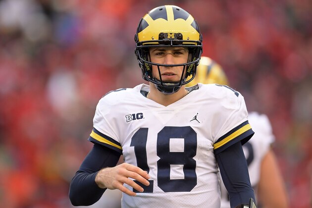 MADISON, WI - NOVEMBER 18:  Brandon Peters #18 of the Michigan Wolverines looks to the sideline during a game against the Wisconsin Badgers at Camp Randall Stadium on November 18, 2017 in Madison, Wisconsin.  Wisconsin defeated Michigan 24-10.  (Photo by Stacy Revere/Getty Images)
