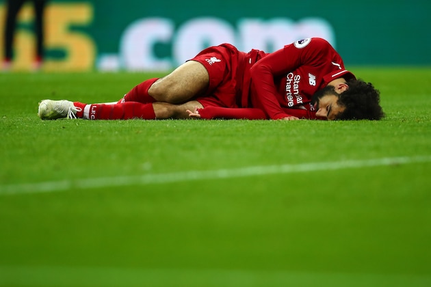 NEWCASTLE UPON TYNE, ENGLAND - MAY 04:  Mohamed Salah of Liverpool reacts after an injury during the Premier League match between Newcastle United and Liverpool FC at St. James Park on May 4, 2019 in Newcastle upon Tyne, United Kingdom. (Photo by Robbie Jay Barratt - AMA/Getty Images)
