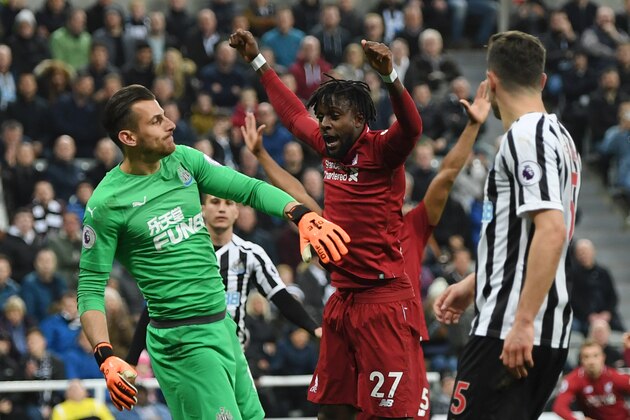 NEWCASTLE UPON TYNE, ENGLAND - MAY 04: Divock Origi of Liverpool celebrates after scoring his team's third goal during the Premier League match between Newcastle United and Liverpool FC at St. James Park on May 04, 2019 in Newcastle upon Tyne, United Kingdom. (Photo by Shaun Botterill/Getty Images)