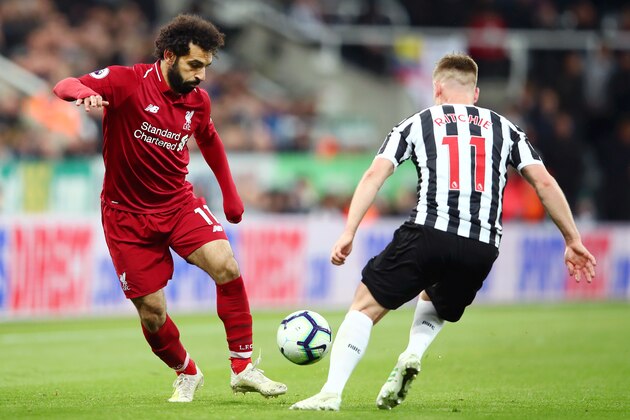 NEWCASTLE UPON TYNE, ENGLAND - MAY 04: Mohamed Salah of Liverpool takes on Matt Ritchie of Newcastle United during the Premier League match between Newcastle United and Liverpool FC at St. James Park on May 04, 2019 in Newcastle upon Tyne, United Kingdom. (Photo by Clive Brunskill/Getty Images)