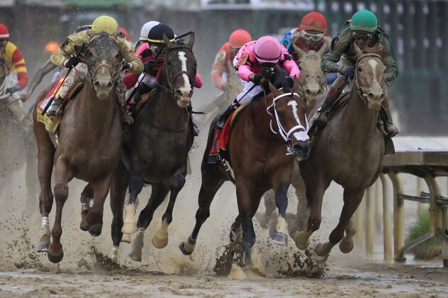 LOUISVILLE, KENTUCKY - MAY 04: Country House #20, ridden by jockey Flavien Prat, War of Will #1, ridden by jockey Tyler Gaffalione , Maximum Security #7, ridden by jockey Luis Saez and Code of Honor #13, ridden by jockey John Velazquez fight for position in the final turn during the 145th running of the Kentucky Derby at Churchill Downs on May 04, 2019 in Louisville, Kentucky. (Photo by Andy Lyons/Getty Images)