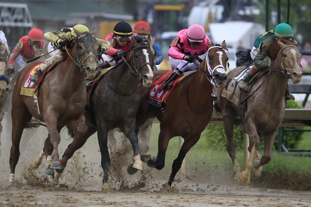 LOUISVILLE, KENTUCKY - MAY 04: Country House #20, ridden by jockey Flavien Prat, War of Will #1, ridden by jockey Tyler Gaffalione , Maximum Security #7, ridden by jockey Luis Saez and Code of Honor #13, ridden by jockey John Velazquez fight for position in the final turn during the 145th running of the Kentucky Derby at Churchill Downs on May 04, 2019 in Louisville, Kentucky. (Photo by Andy Lyons/Getty Images)